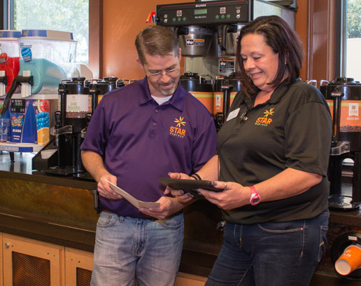 image of hands on staff training to address C-Store Staff Retention