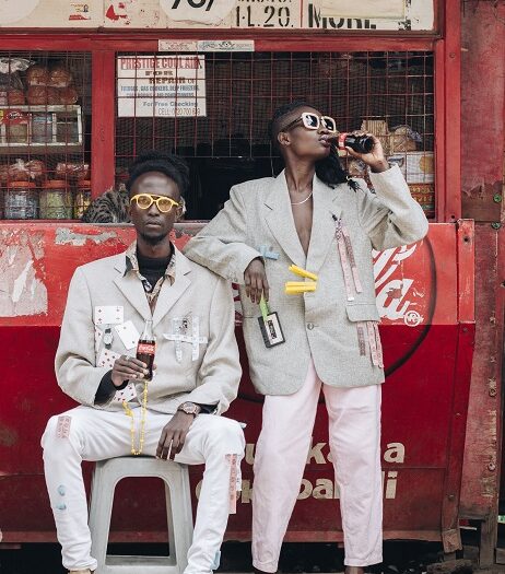 Image of a local store in Kenya showing a distinct style or barnd with dapper young customers enjoying a pop. Store manager ROI strategy involves three components. Chain impact, store operations and chain support drive the return on store investments.