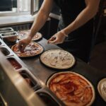 Image of fresh pizza preparation for c-store food service. It is clear that there are five keys to grow food sales. C-store managers thrive when the keys are practiced well.