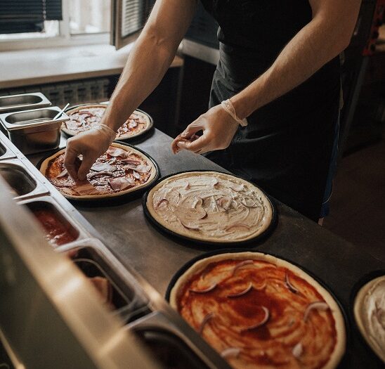 Image of fresh pizza preparation for c-store food service. It is clear that there are five keys to grow food sales. C-store managers thrive when the keys are practiced well.