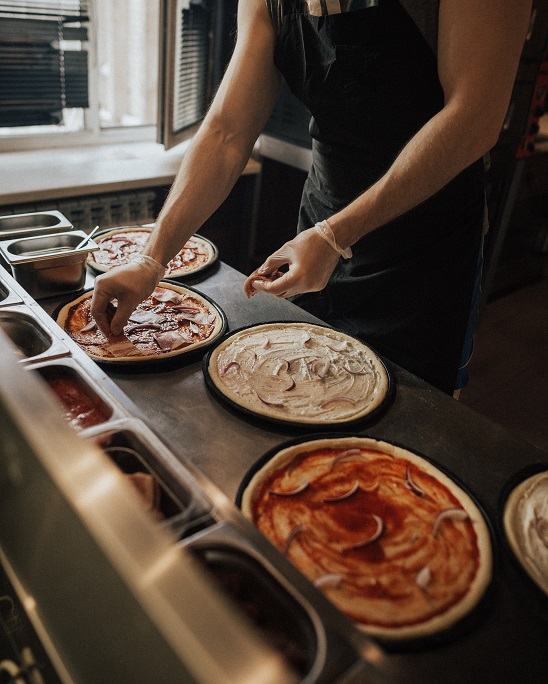 Image of fresh pizza preparation for c-store food service. It is clear that there are five keys to grow food sales. C-store managers thrive when the keys are practiced well.