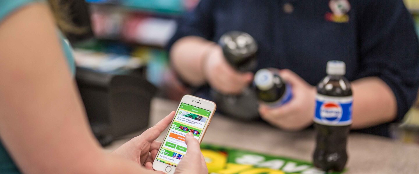 Image of GoMart customer using loyalty applciation. One of the strategic improvements.