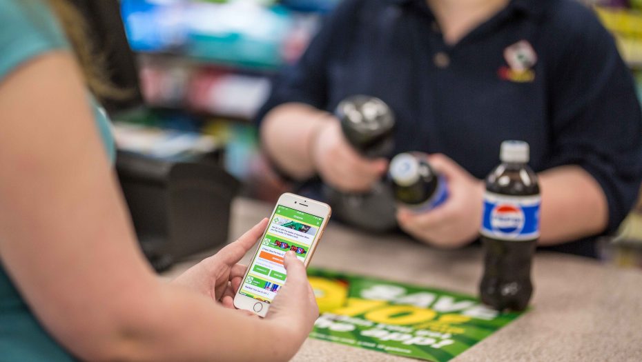 Image of GoMart customer using loyalty applciation. One of the strategic improvements.