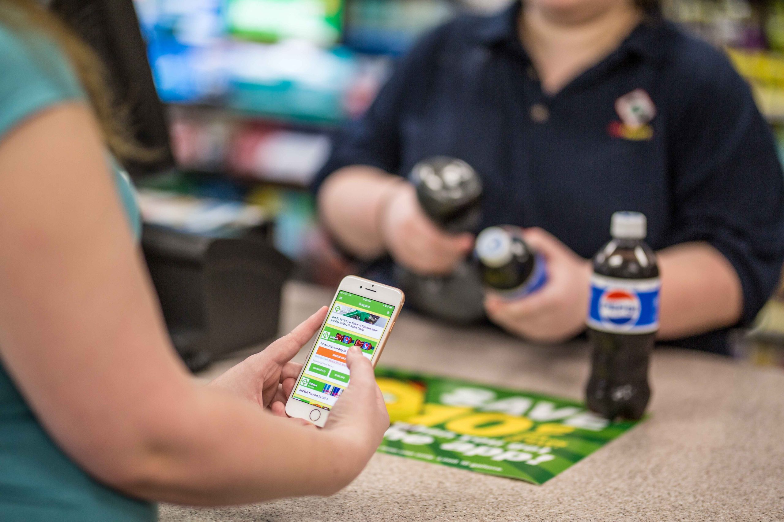 Image of GoMart customer using loyalty applciation. One of the strategic improvements.