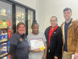 Dylan Conley recognizing a convenience store employee for outstanding performance and teamwork.
